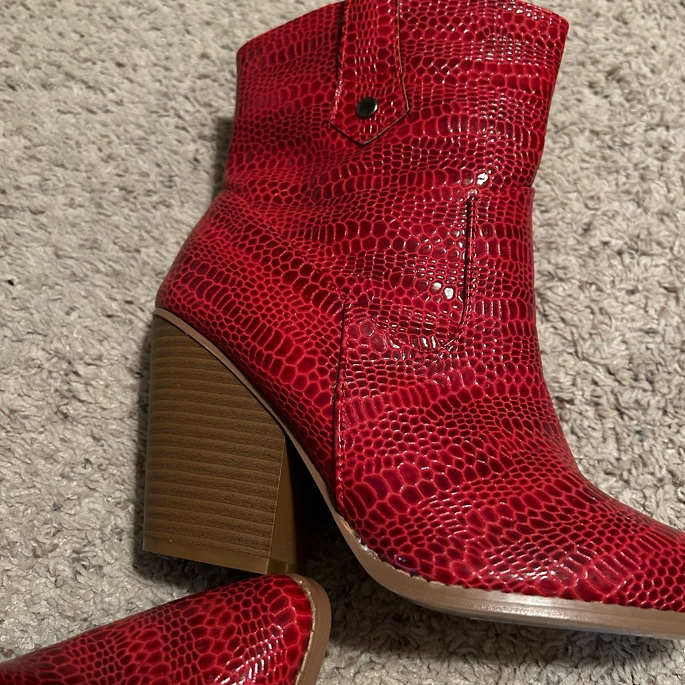 Red boots brand new never worn and will fit a wide foot as well